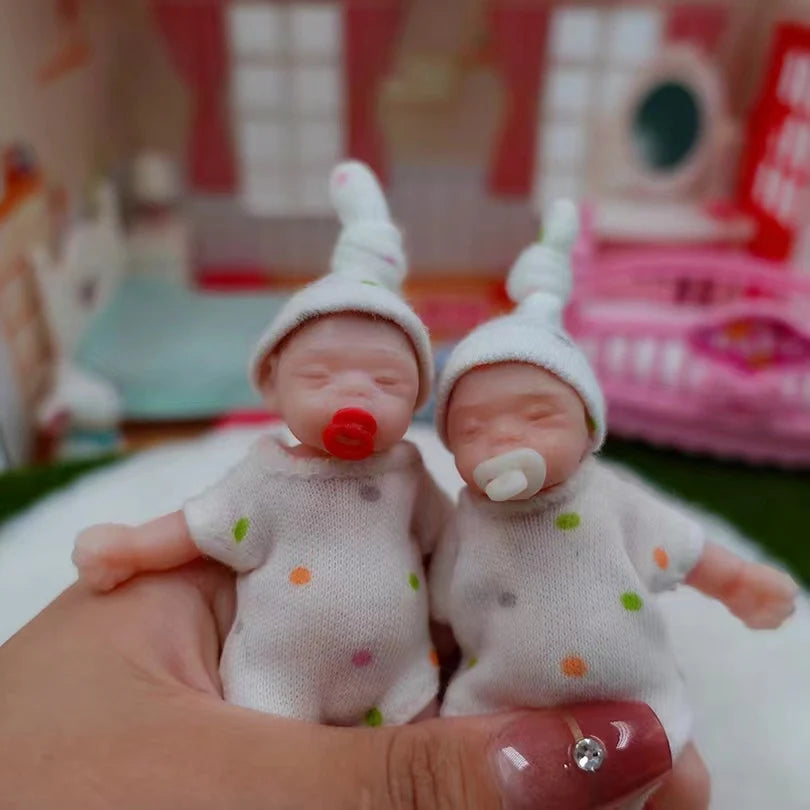 8Cm Cute Mini Silicone Bebe Reborn Girl with 2 Sets Mini Outfits for Each Reborn Baby Girl Soft Touching Feeling Flexible Doll
