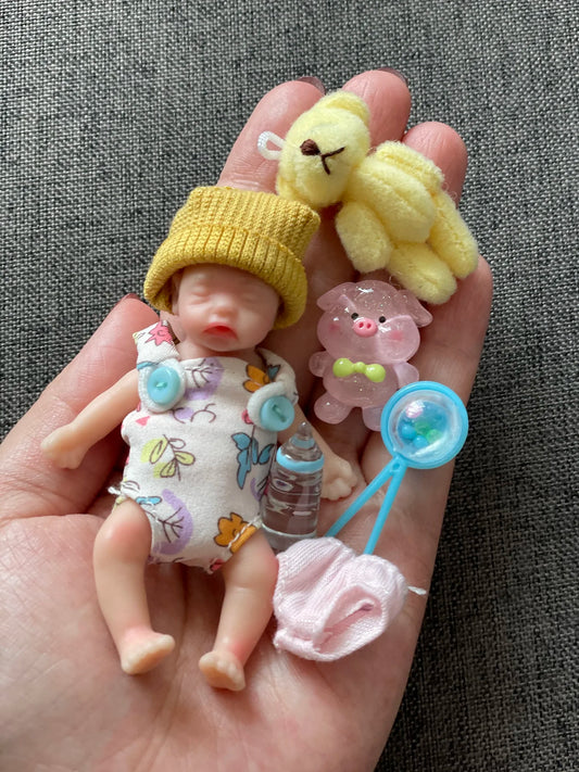 8Cm Cute Mini Silicone Bebe Reborn Girl with 2 Sets Mini Outfits for Each Reborn Baby Girl Soft Touching Feeling Flexible Doll